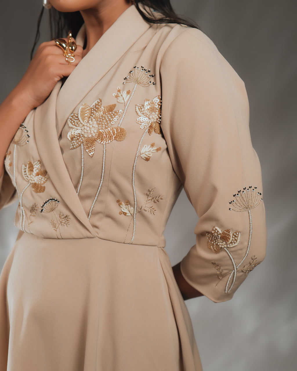 UNA SHAWL COLLAR DRESS featuring intricate hand embellishments on sleeves and front.