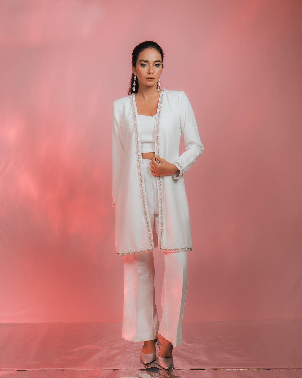 NUA RHINESTONES & PERAL EMBELLISHED JACKET worn with stylish outfit against pink background.