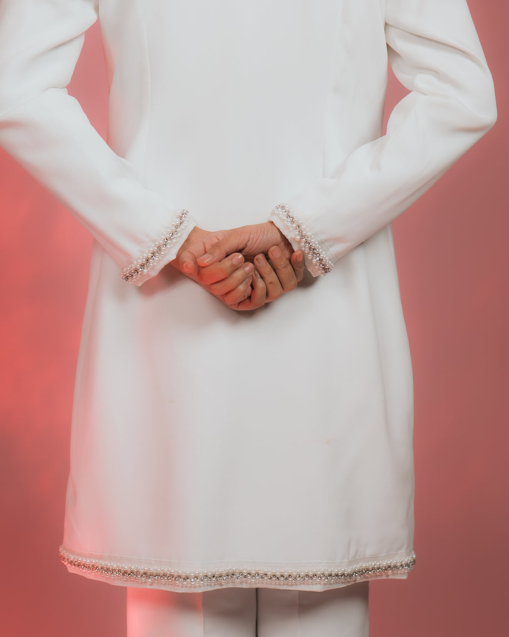 NUA RHINESTONES & PERAL EMBELLISHED JACKET showcasing elegant pearl and rhinestone details on sleeves and hem.